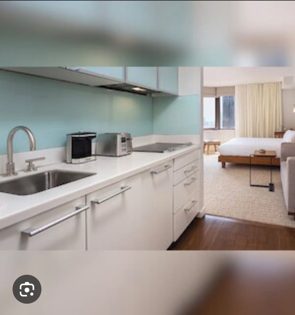 Modern kitchen with bedroom view