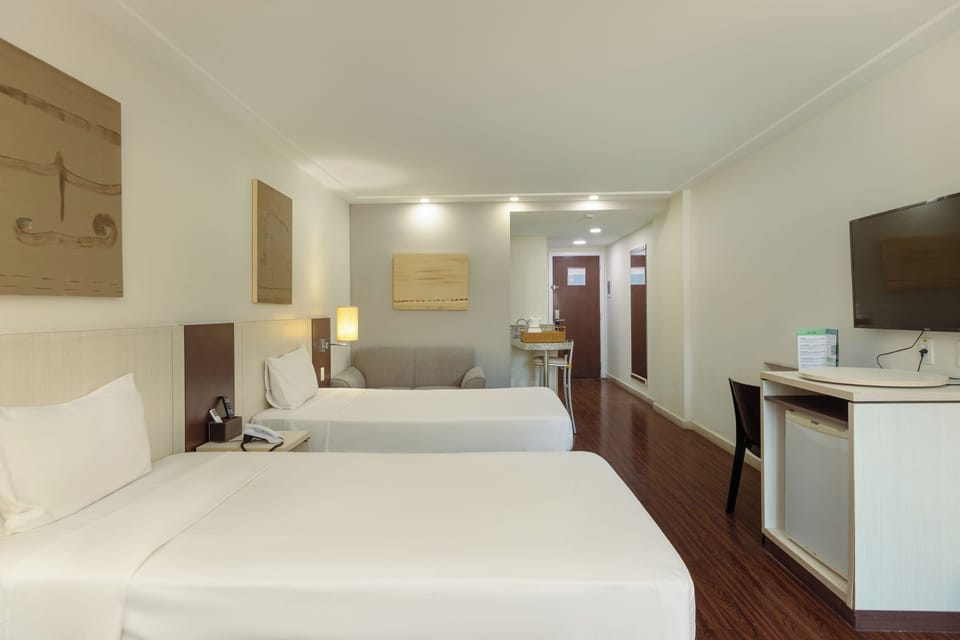 Deluxe Suite, 2 Twin Beds | In-room safe, desk, laptop workspace, iron/ironing board