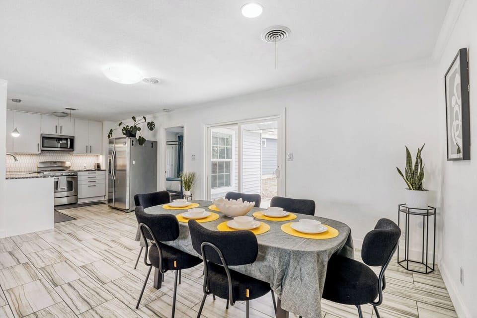Bright dining area connecting seamlessly to the kitchen and backyard patio