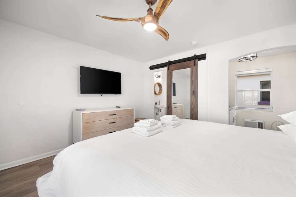 Room overview- King bed, closet, dresser, TV, and kitchenette