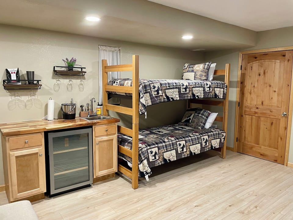 Our downstairs living room features a twin bunk bed and a pull-out sofa bed. 