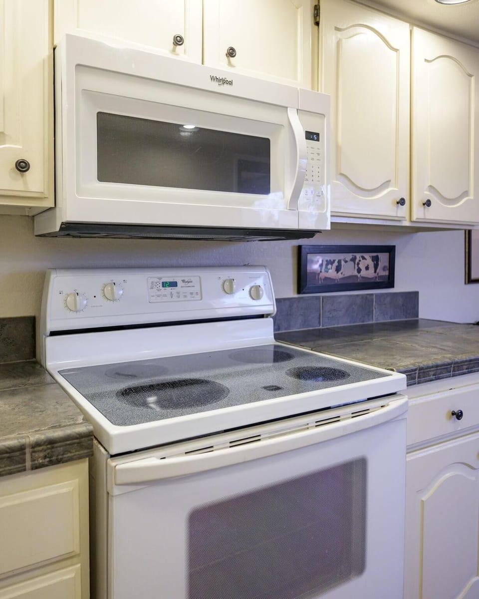 Bright, fully equipped kitchen with modern appliances for easy cooking