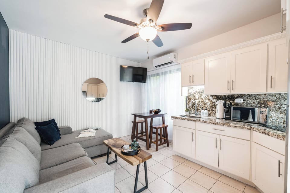 A cozy lounge area paired with dining space makes this suite feel both functional and inviting.