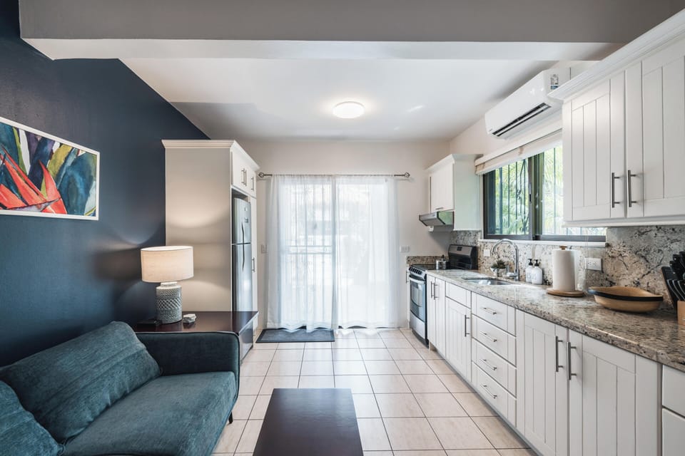 The open living and dining area creates a welcoming space to relax after a day in the sun.