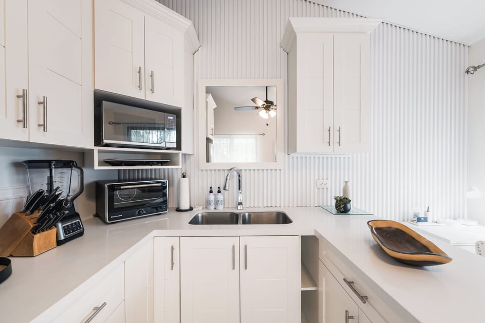 The kitchenette provides everything needed for light meals, snacks, and easy breakfasts at home.