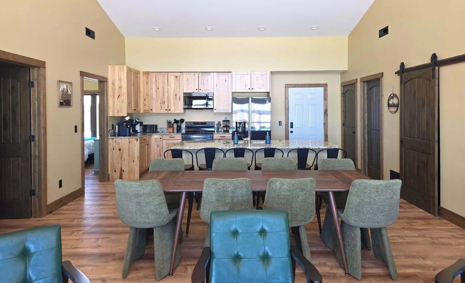 Open concept dining area into the kitchen and first living room allows everyone to visit during meal prep time.