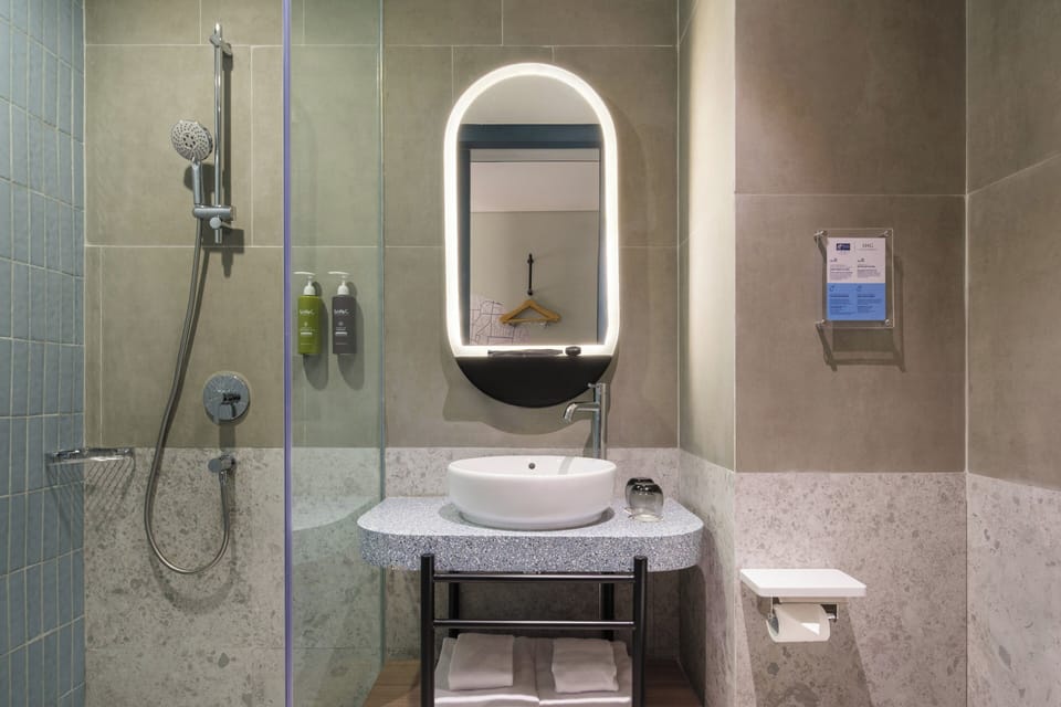 Shower, free toiletries, hair dryer, slippers