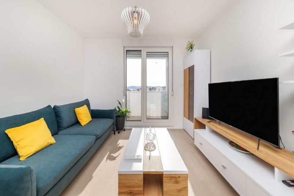Apartment, Balcony, City View | Living area | Flat-screen TV