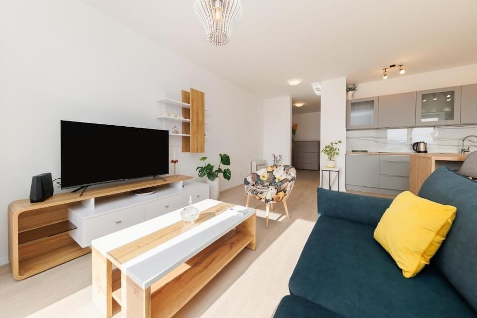Apartment, Balcony, City View | Living area | Flat-screen TV