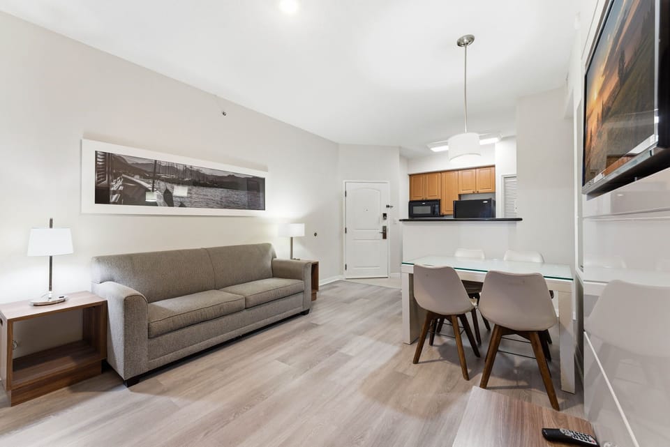 Living room with dining table and sofa bed