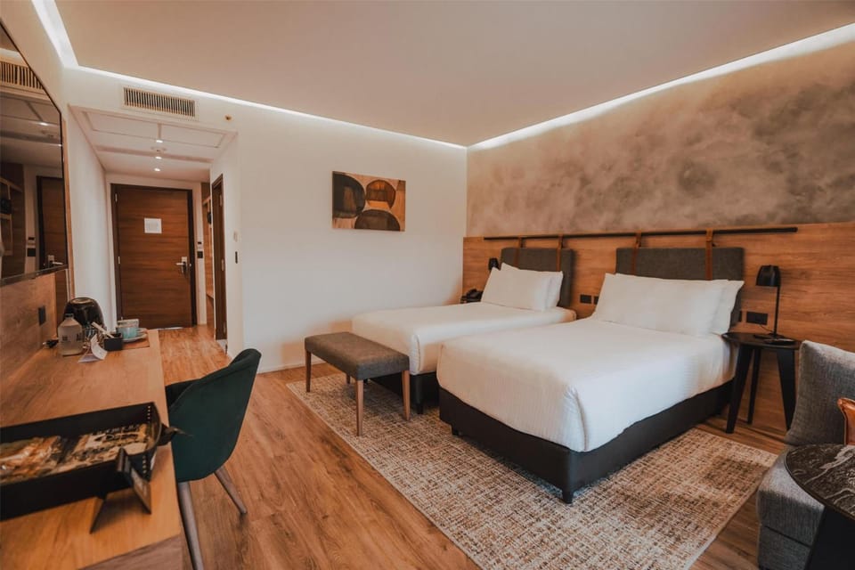 Relax in a spacious double room with serene modern design.