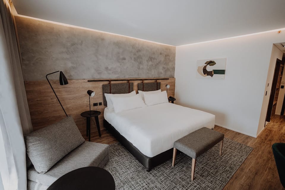 Settle into crisp linens and a calm, modern retreat.