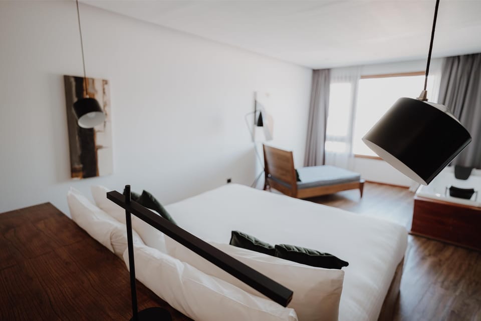 Lounge by the window on a soft daybed in daylight