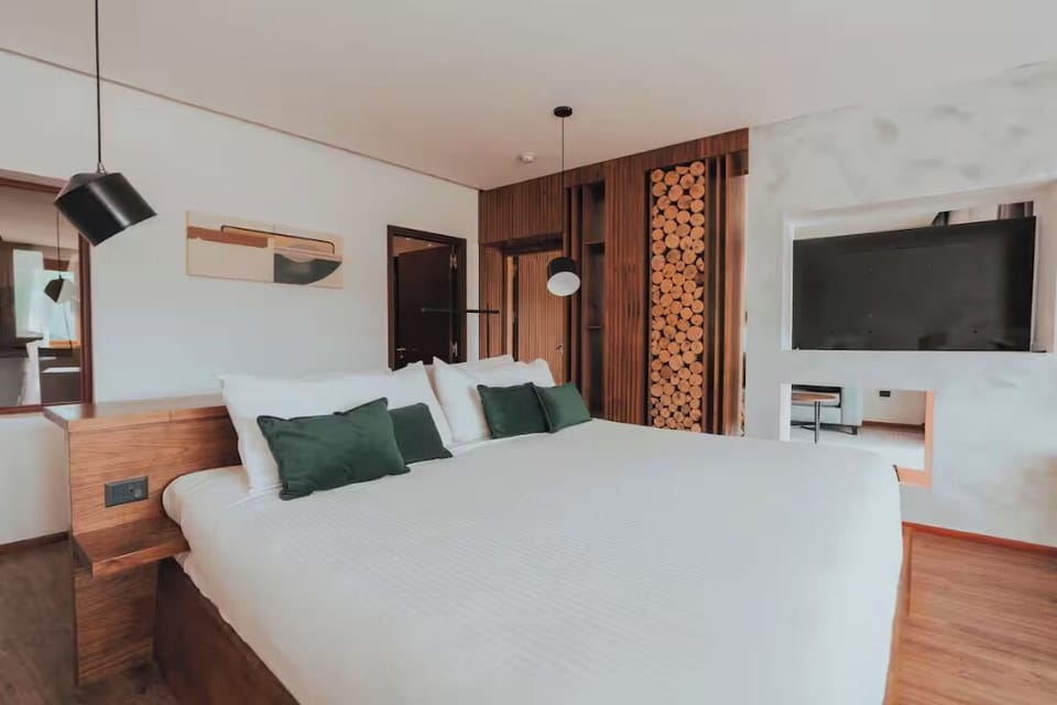 Relax in bed with modern comforts and feature-wall TV