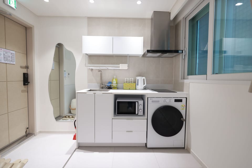 Standard Double Room, City View | Private kitchen | Full-size fridge, microwave, stovetop, cookware/dishes/utensils