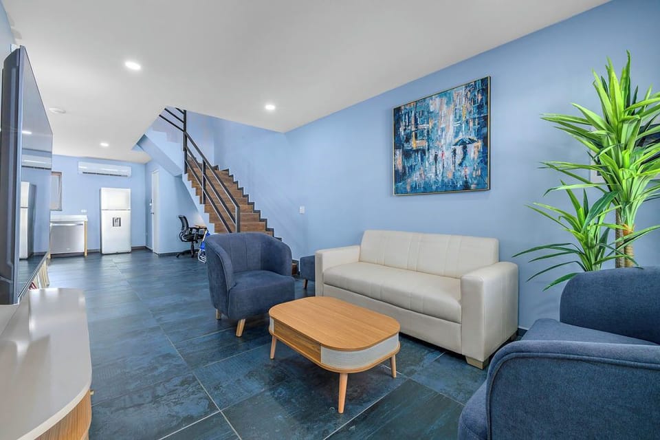 Step into a space designed for comfort and coastal vibes. Our modern living area blends sleek design with cozy charm, featuring calming blue tones inspired by the island.