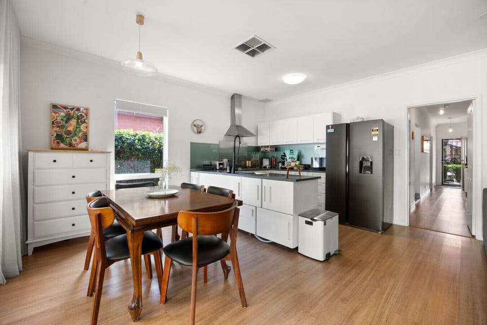 From the kitchen, you can stay connected with the living and dining areas while cooking or enjoying a morning coffee.