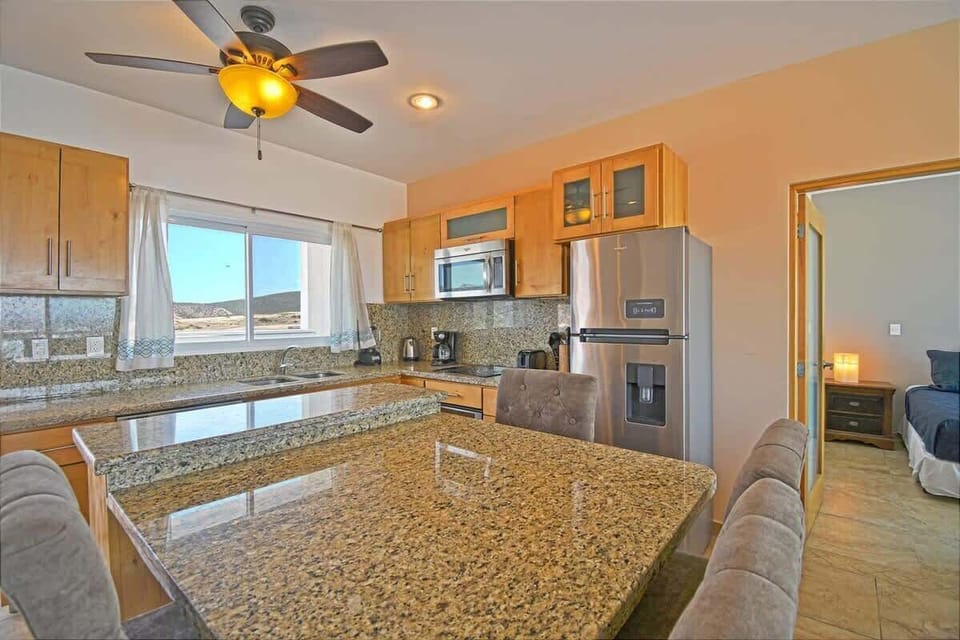 Whip up meals in this fully equipped kitchen with ample counter space and scenic views.
