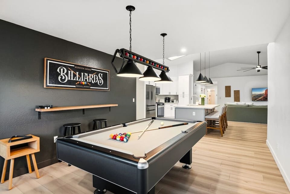 Game room with a Billiards pool table, seating, and easy access to the rest of the house