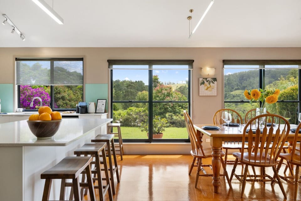 Open-plan kitchen and dining areas with balcony access