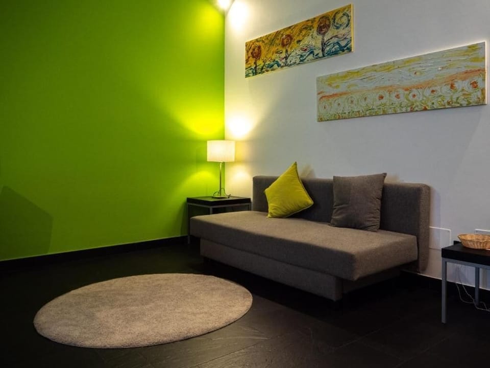 Apartment, City View | Living area | Flat-screen TV