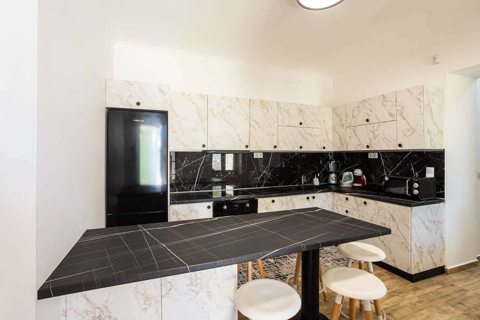 Fully equipped kitchen with modern appliances.
