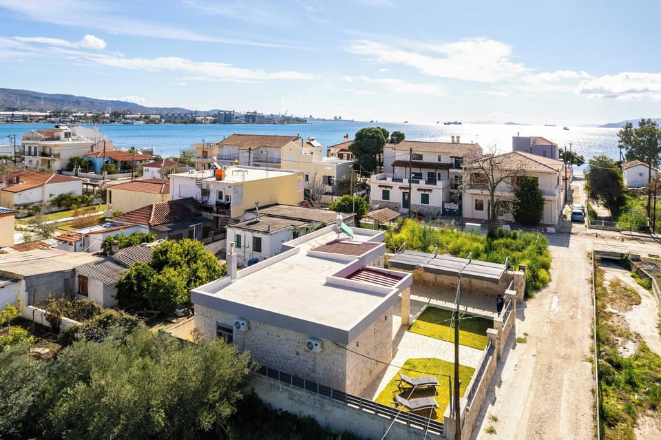 Elevated view of the neighborhood and nearby sea.
