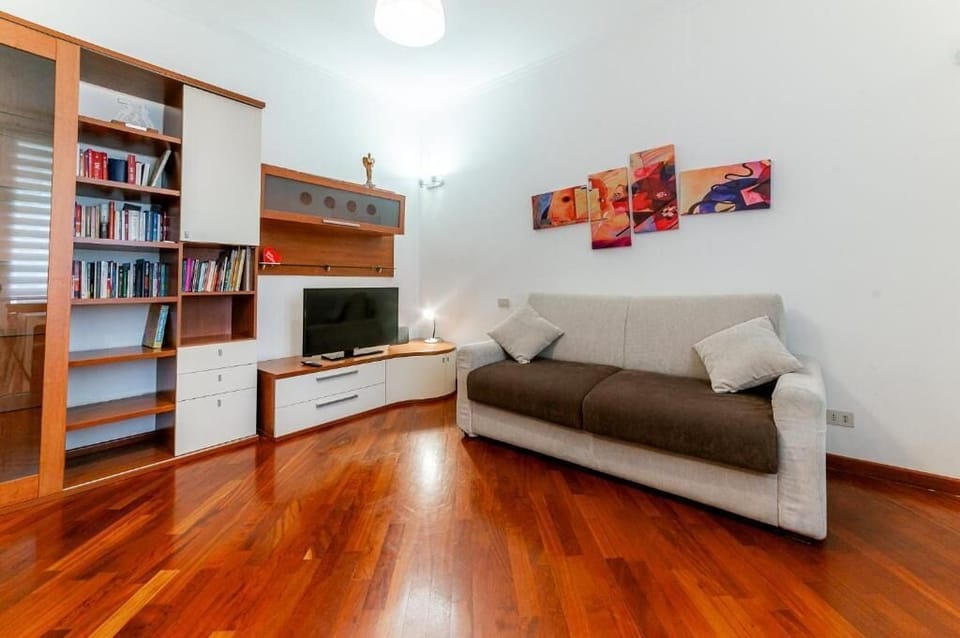 Standard Apartment, City View | Living area | Flat-screen TV