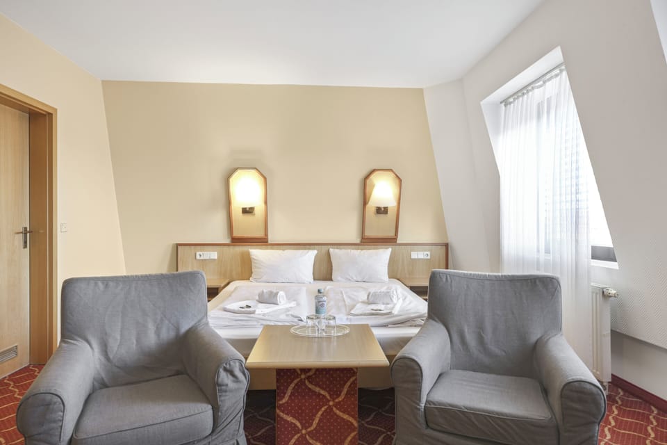 Comfort Quadruple Room, City View | Desk, laptop workspace, blackout drapes, iron/ironing board