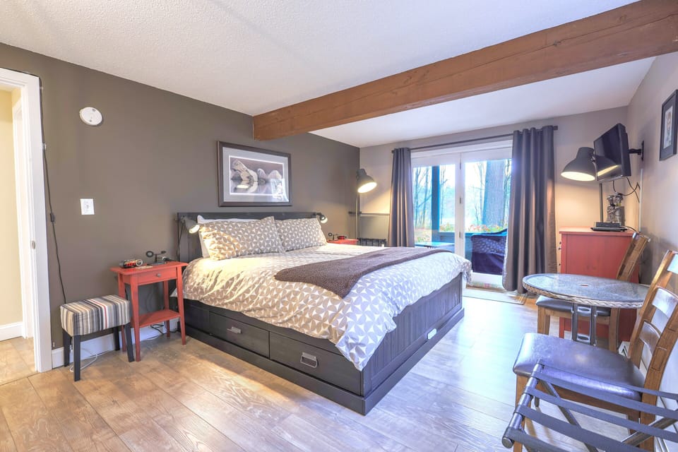 Master bedroom has a king bed in and a flat screen TV