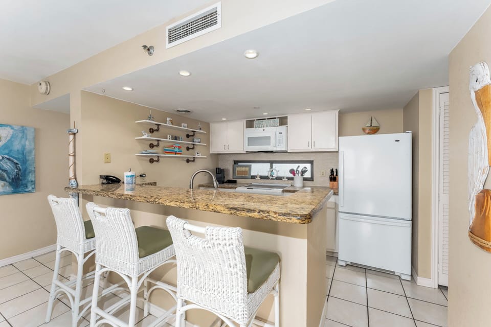 Enjoy a quick lunch at the kitchen bar between trips to the pool and beach!