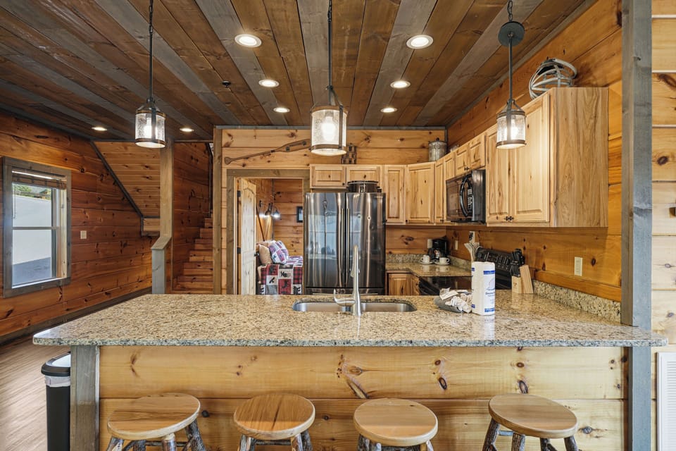 Kitchen with ample counter space & bar seating