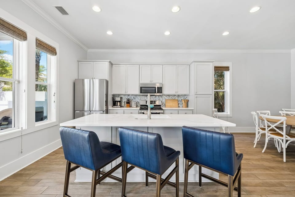 Full kitchen with a large island and bar seating