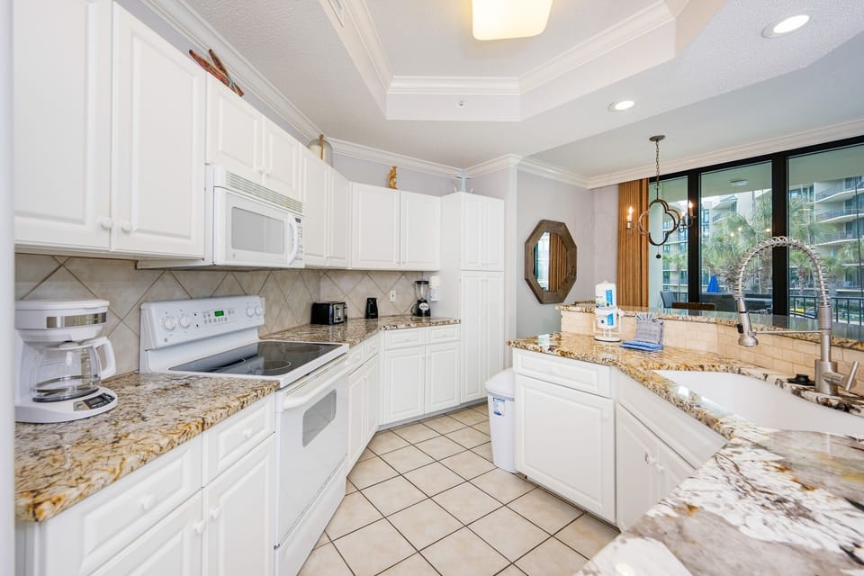 Condo, 2 Bedrooms | Private kitchen | Coffee/tea maker, fridge, oven
