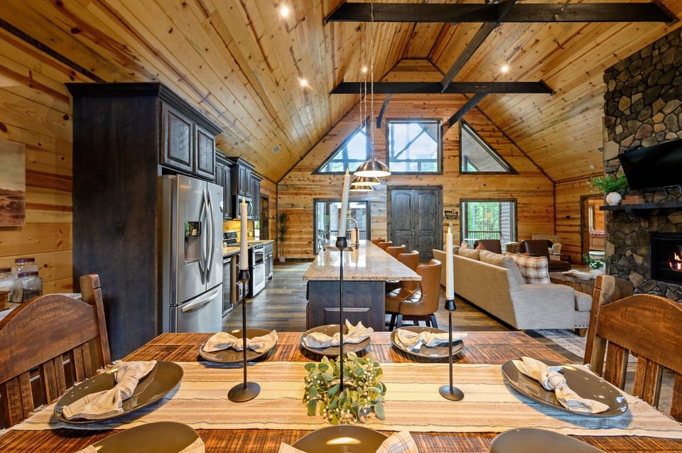 Beautiful dining area framed by soaring ceilings and lodge charm