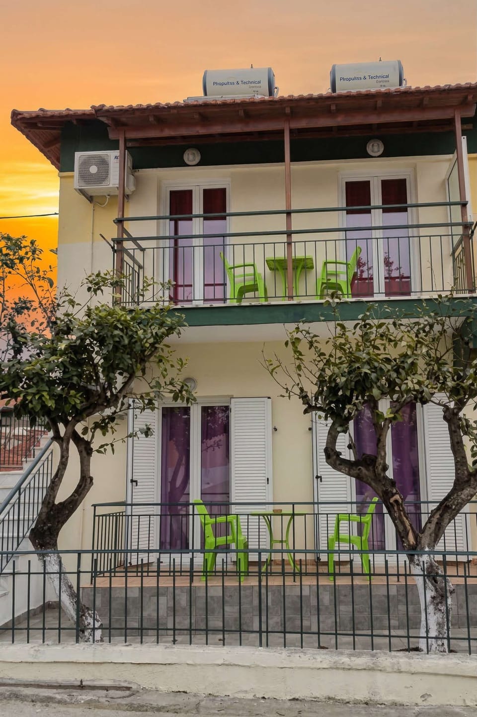 Exterior view of the property surrounded by greenery