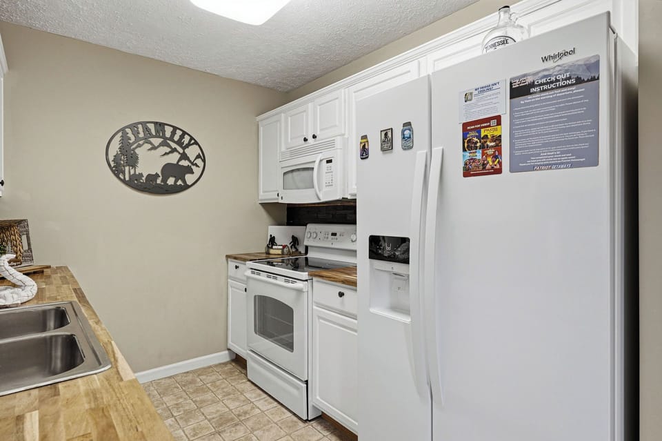 Your fully equipped kitchen features modern appliances and ample counter space for preparing memorable meals during your stay.