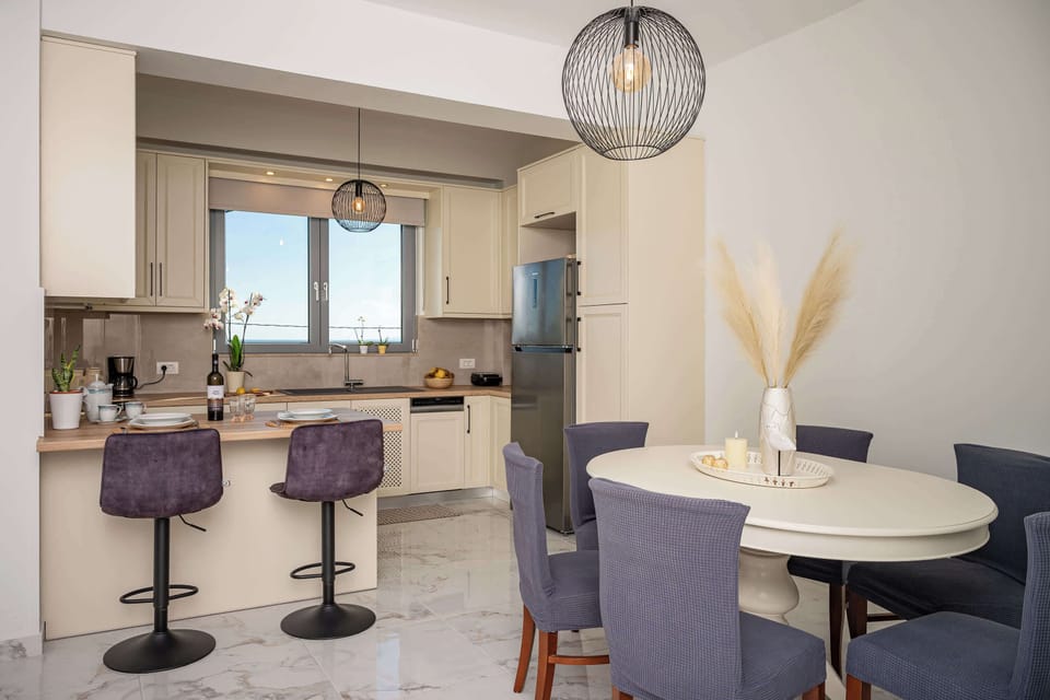 Dining area with sea views and an open-plan layout that connects naturally to the kitchen and living space.