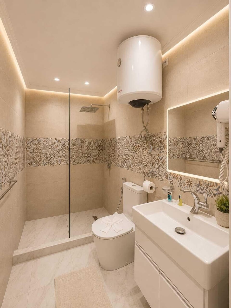 Separate tub and shower, hydromassage showerhead, designer toiletries