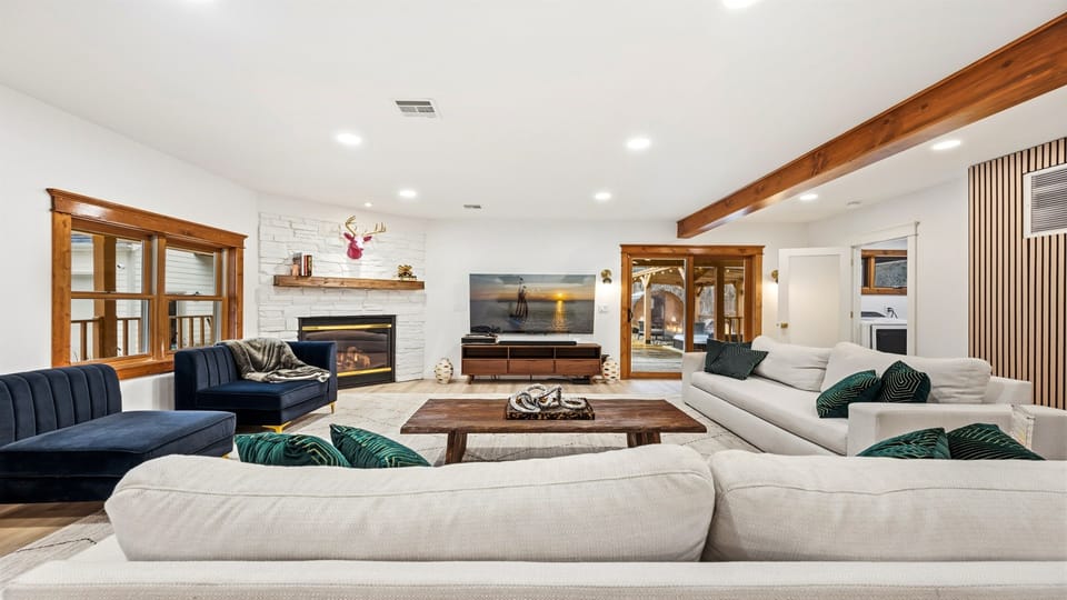 With natural wood beams and expansive windows, this space is infused with the timeless charm of Door County.