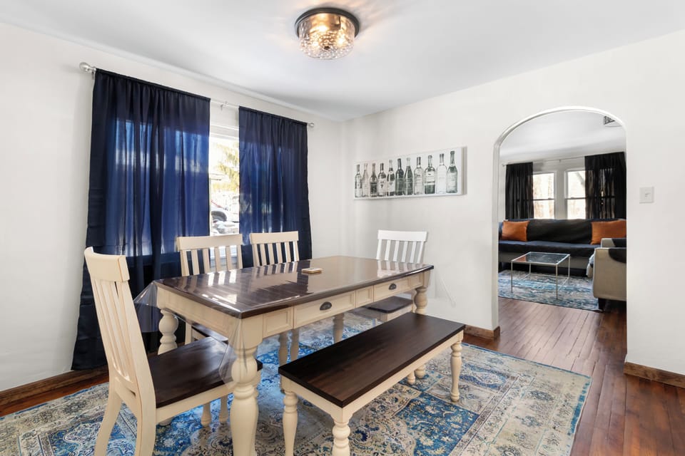 Bright dining area with a charming table and comfortable seating.