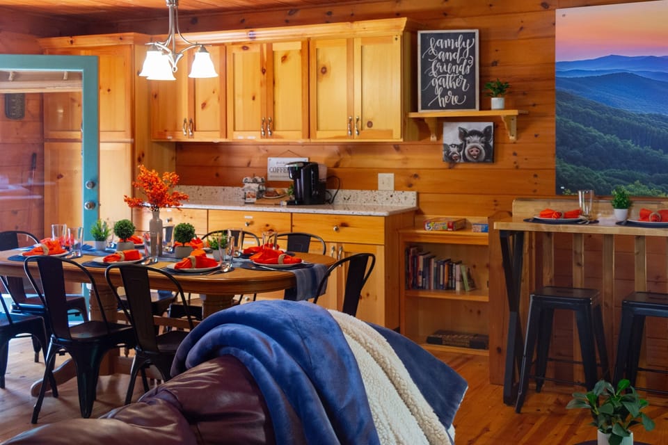 The cozy living room flows directly into the kitchen and dining area.