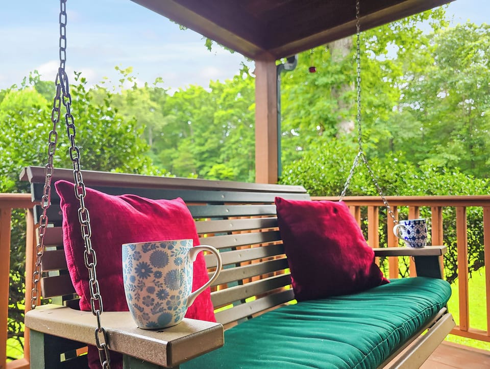 The porch swing is a great spot to sit and enjoy a morning coffee without a neighbor in sight!