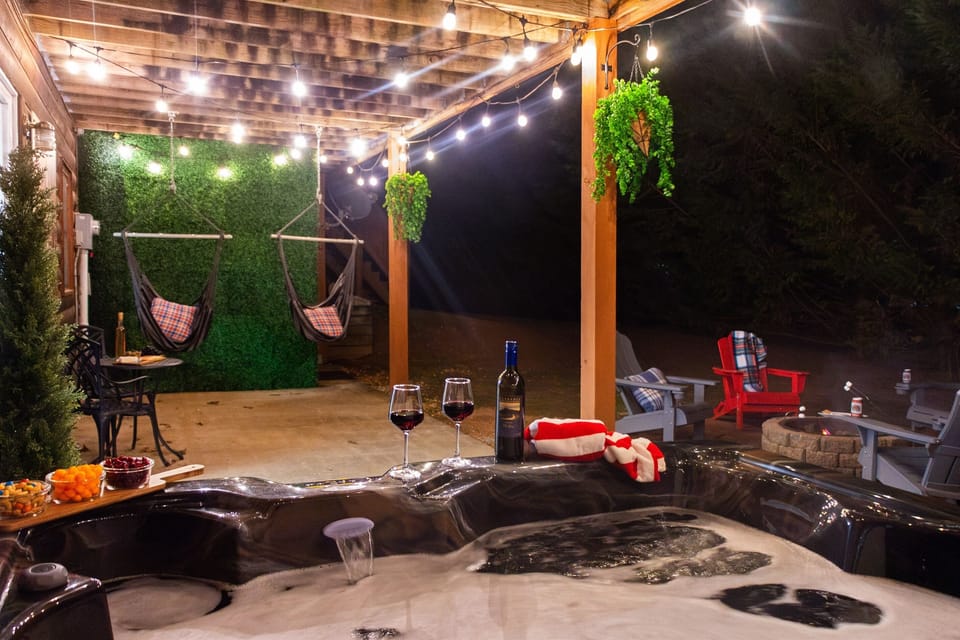 Swinging hammock chairs, hot tub and fire pit...perfect for time spent together!