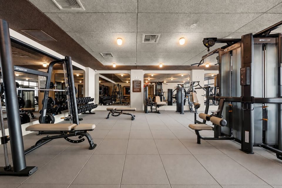 Precor fitness center. Free weights, machines, cardio, TRX, and room to train.