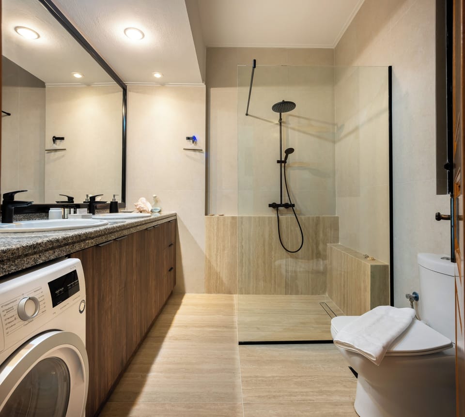 Bright, well-lit bathroom with a clean and minimalist design. 
