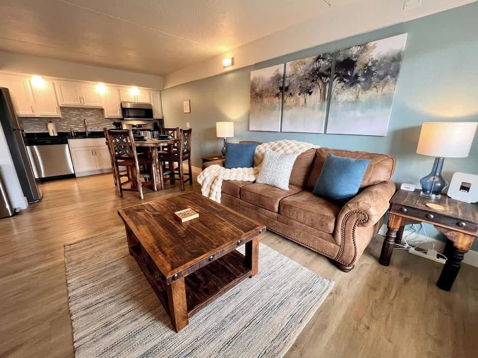 Sofa sleeper in living room. Linens provided