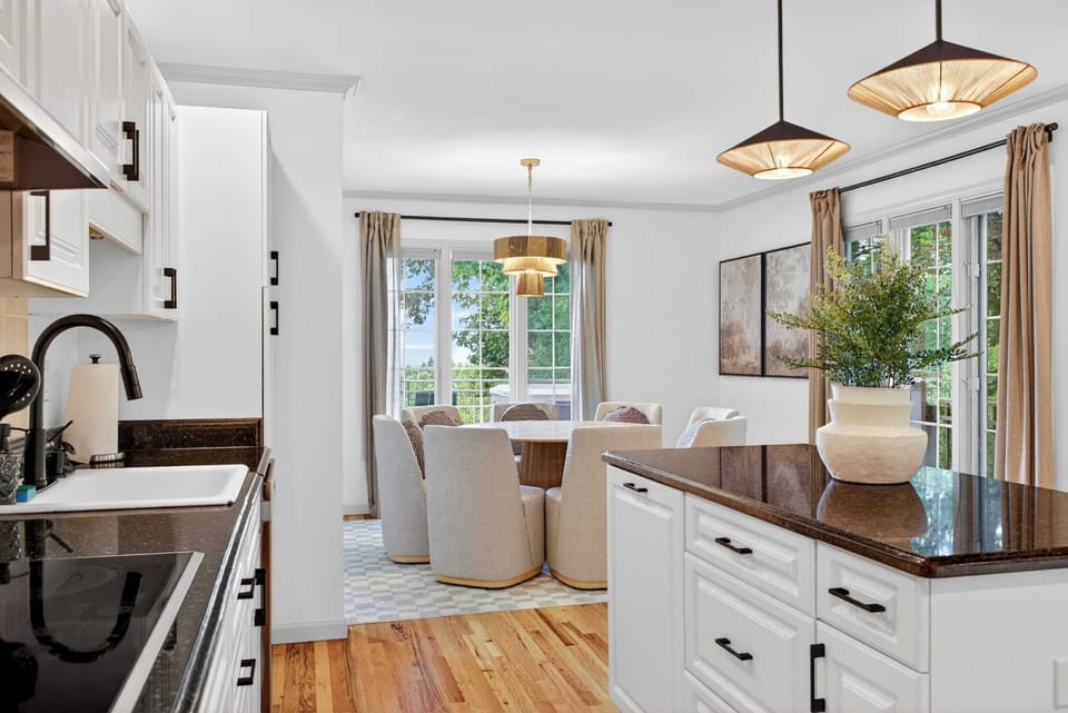 Enjoy delicious meals and meaningful conversations in our elegant, light-filled dining space, conveniently located right off the modern kitchen for easy entertaining.