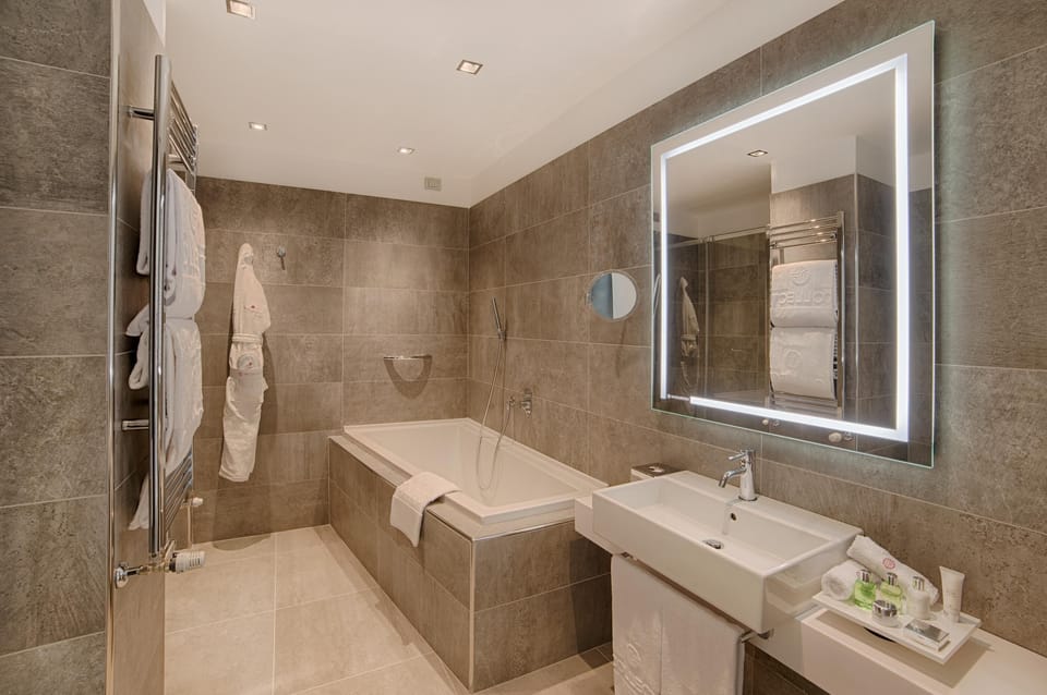 Shower, eco-friendly toiletries, hair dryer, bathrobes