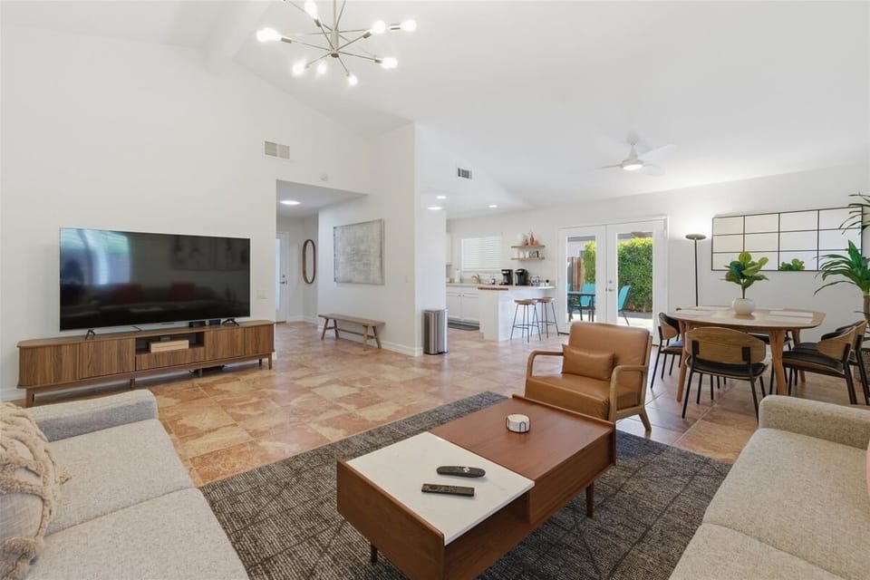 Open living area with vaulted ceilings and modern furnishings